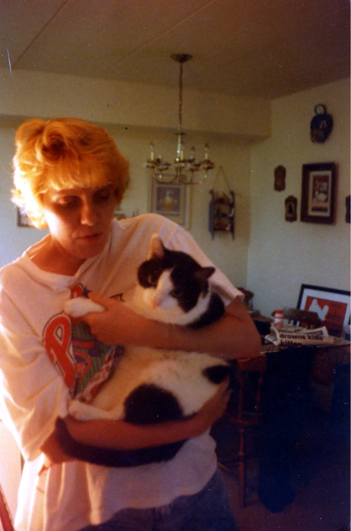 Patti holding her cat, Woody